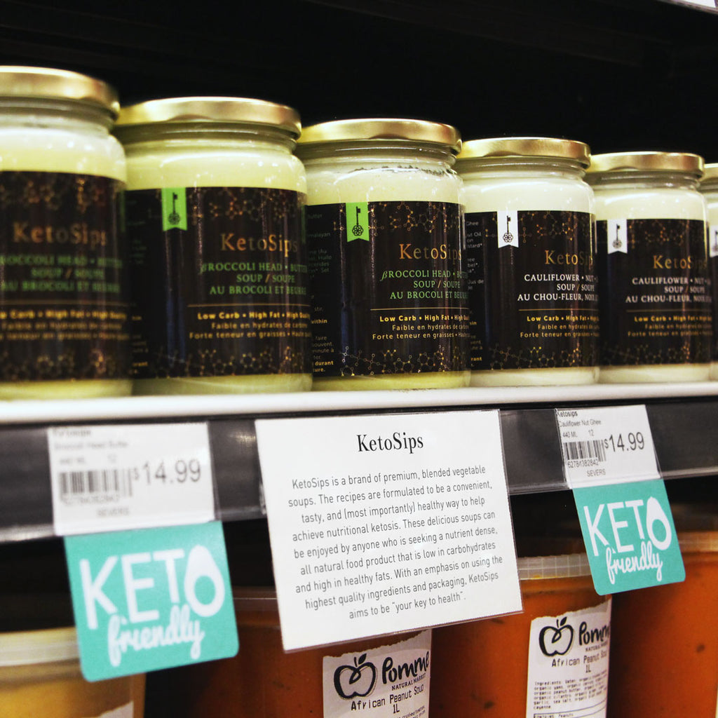 Jars of keto soups on a shelf edge with 'Keto friendly' Shelftalkers installed into the ticket molding below.
