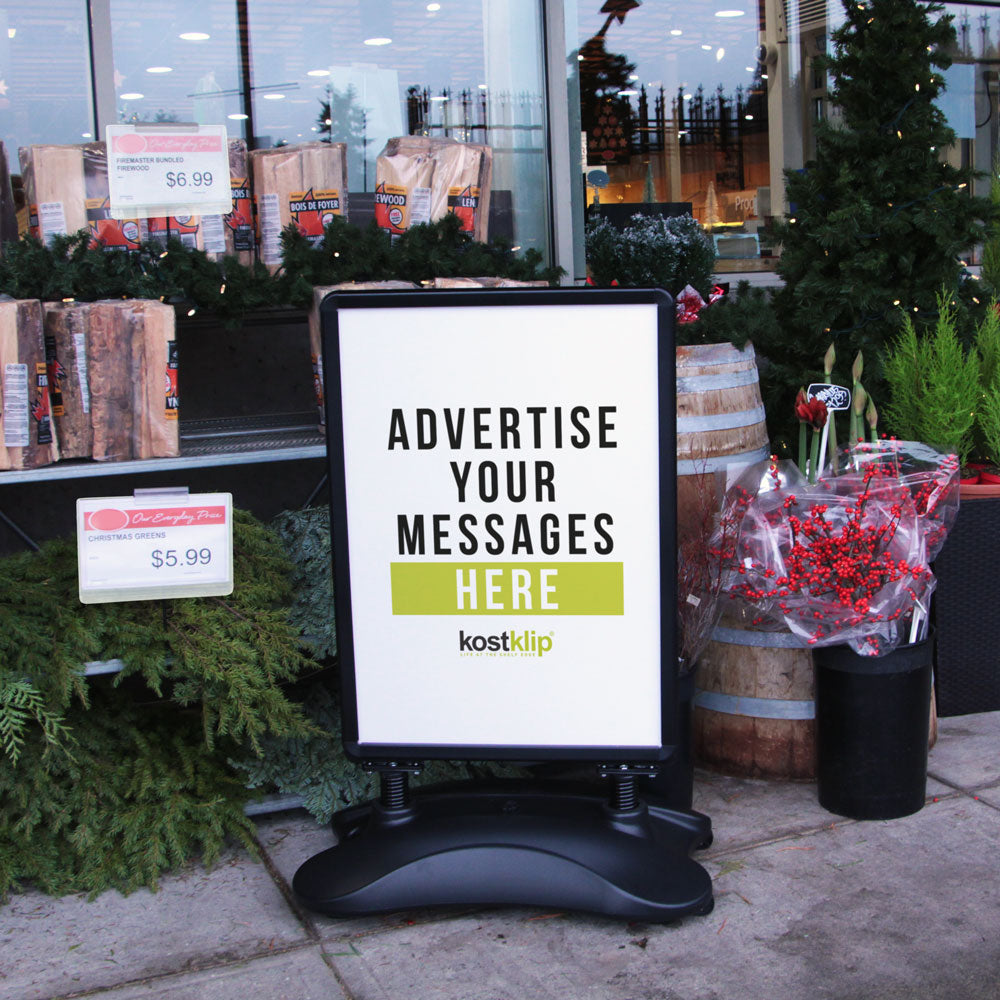 A WalkTalker outdoor sign holder in front of a grocery store