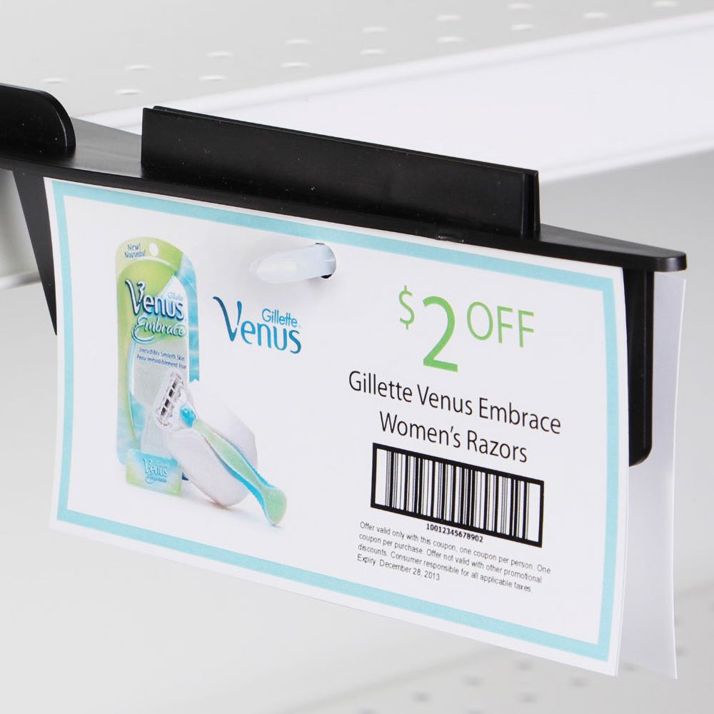 the Double Headed Arrow Pin installed into a display strip hanger, holding a pad of coupons