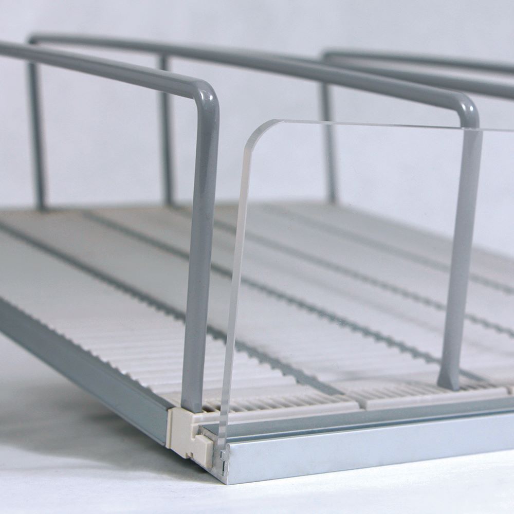 a close up of the front corner of the EasyRoller shelf management system highlighting the front fence