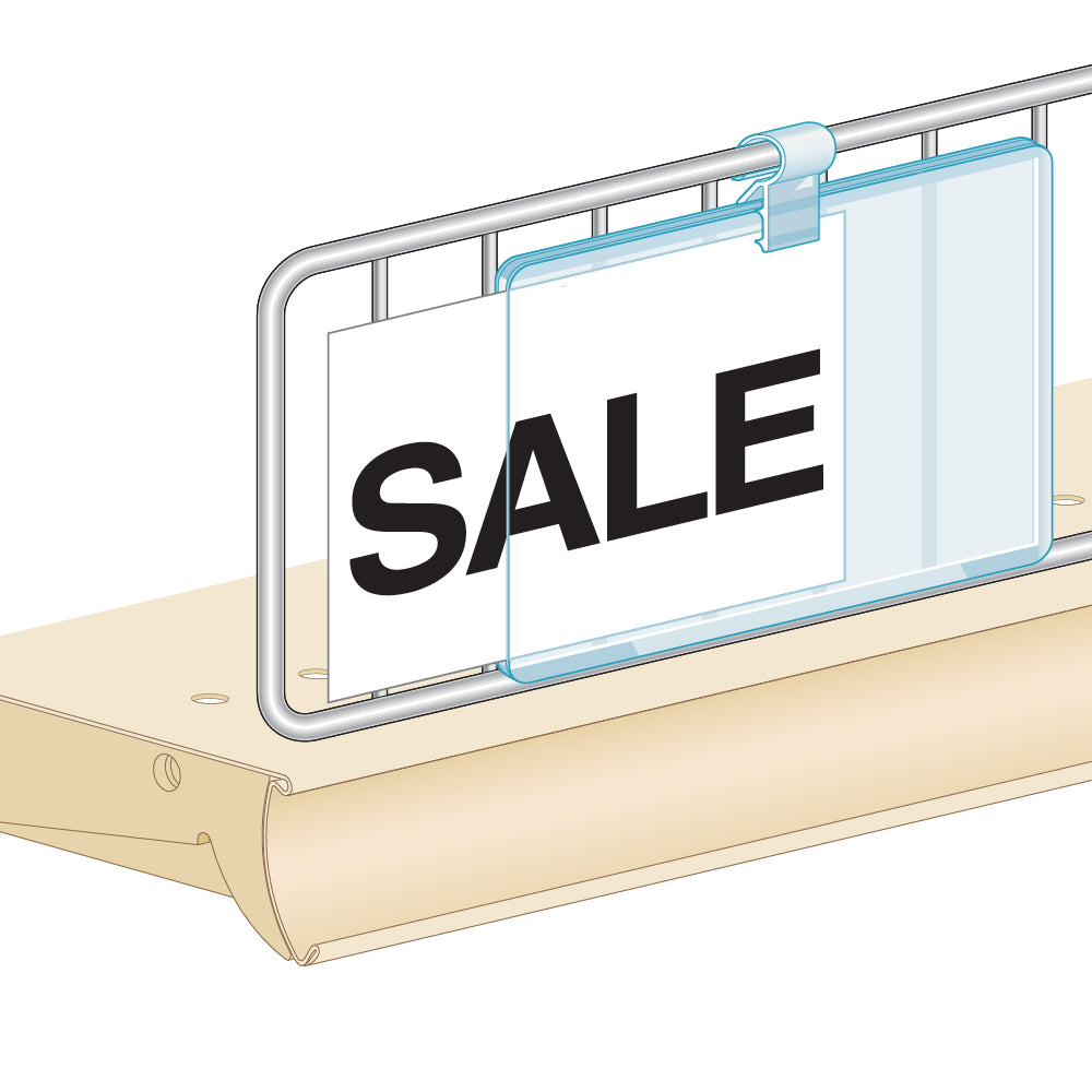 An illustration of the PowerGrip Wire Fence & Basket Sign Clip & Grip installed on a wire fence, gripping a sign protector holding a "Sale" sign