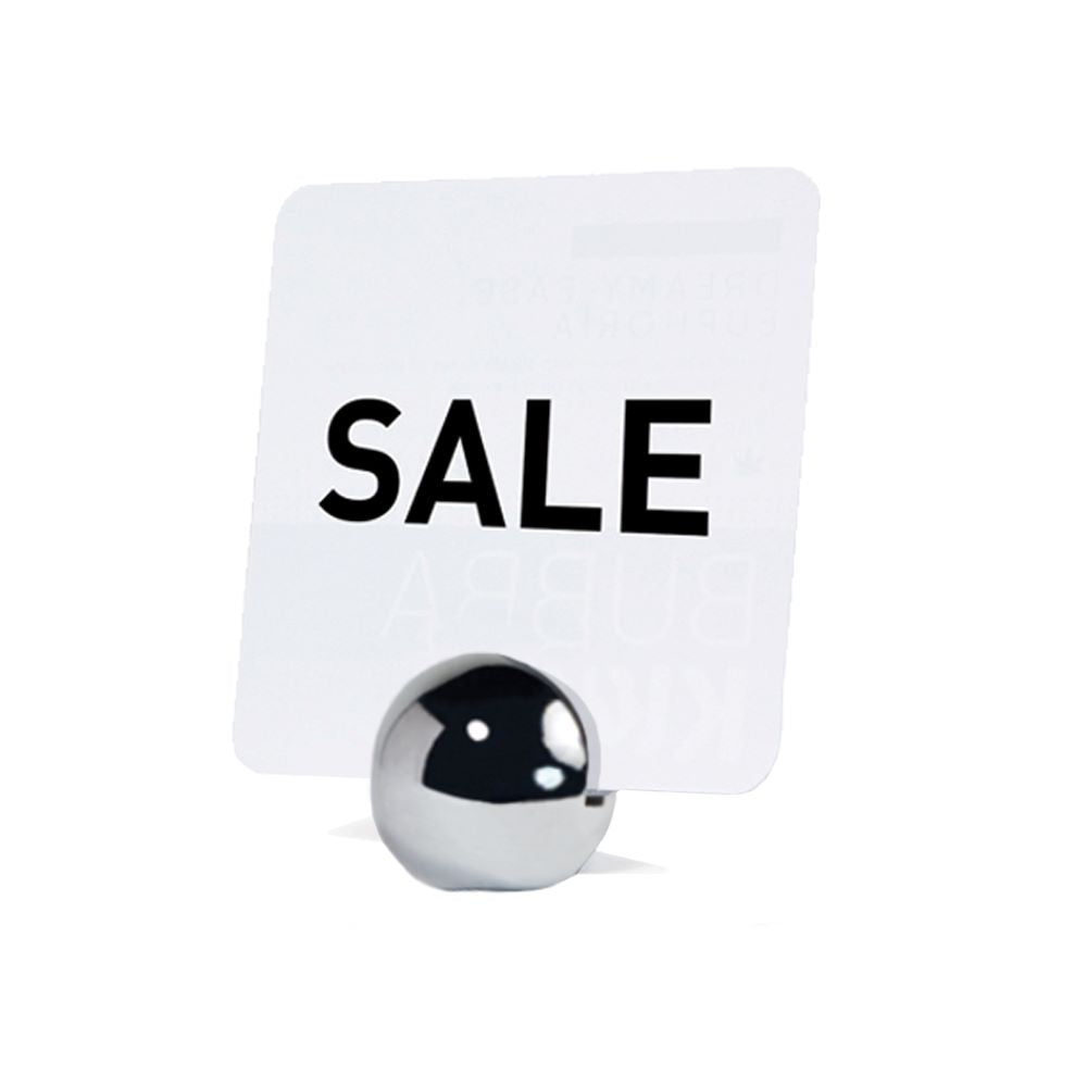 The sphere Stainless Steel Sign Holder holding a "sale" sign